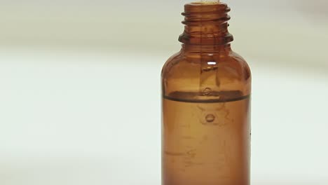 showcasing an organic skin serum in a glass bottle dropper shot in close up selective focus depicting health, beauty and skincare industry