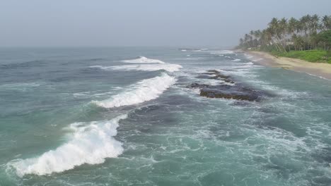 aerial view. aerial drone footage of ocean waves breaking