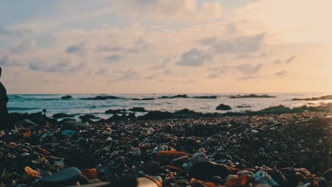 Man-walking-German-Sheppard-at-the-beach-during-sunset