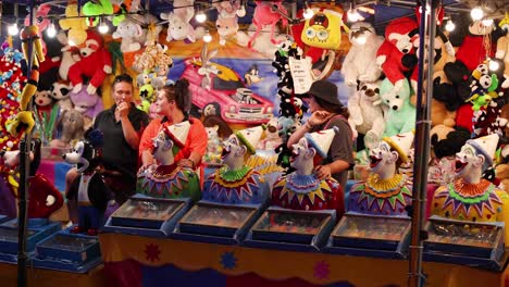 people playing carnival game to win prizes