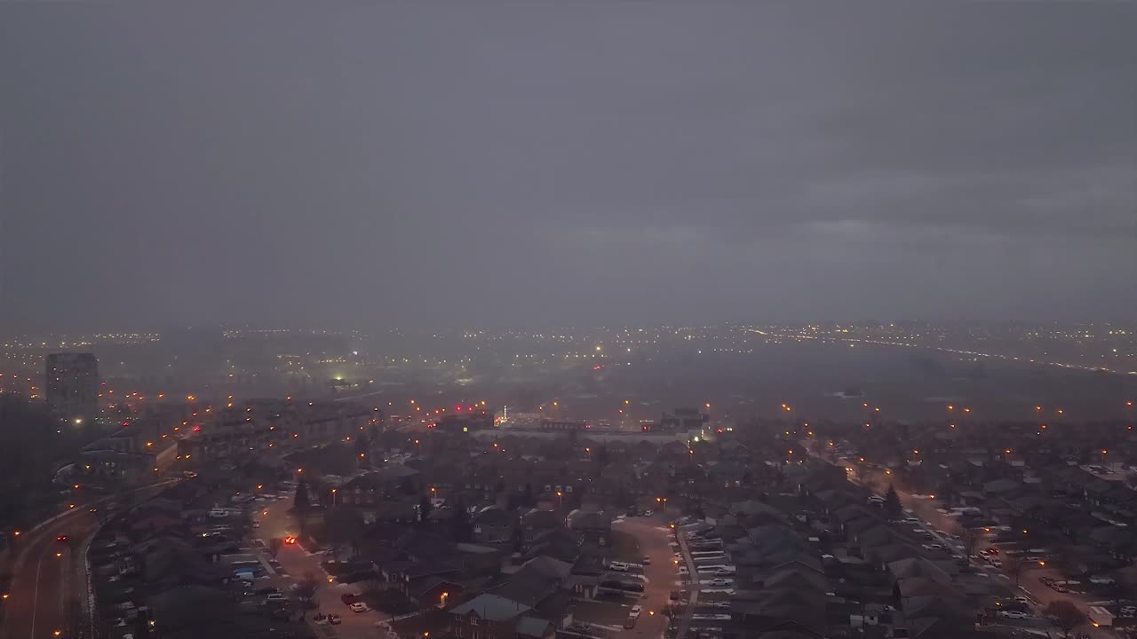 Timelapse overlooking Toronto, Canada. Fog and cloudy night.