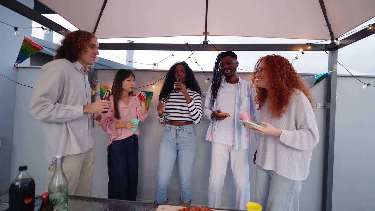 Friends celebrating at a rooftop party