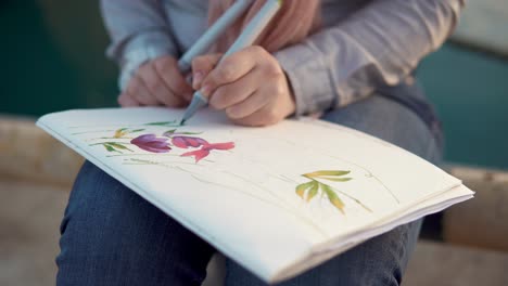 woman drawing flowers