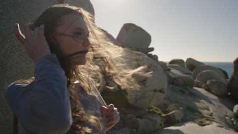 close-up-brave-young-tourist-woman-looking-at-beautiful-ocean-seaside-view-enjoying-exploring-on-independent-vacation-adventure