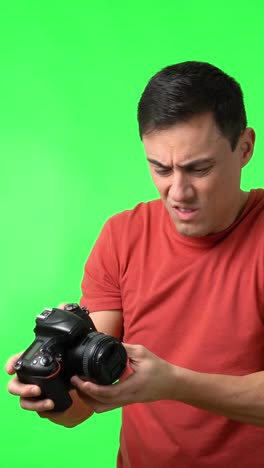 man with camera on green screen