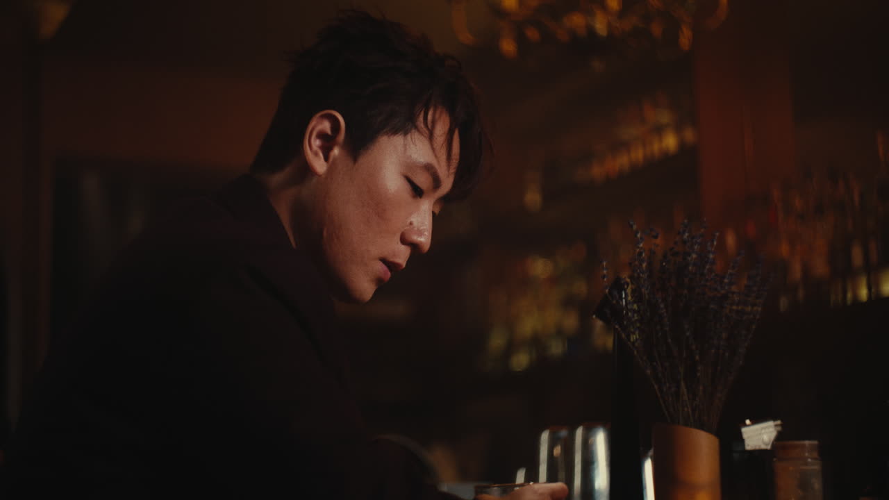 Man in a Bar at Night