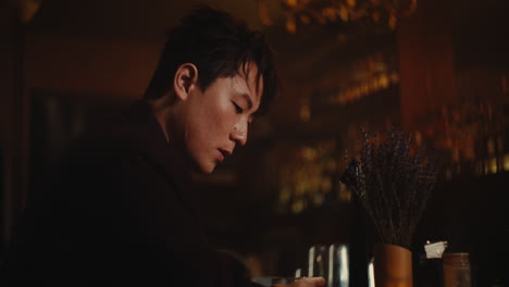 man in a bar at night