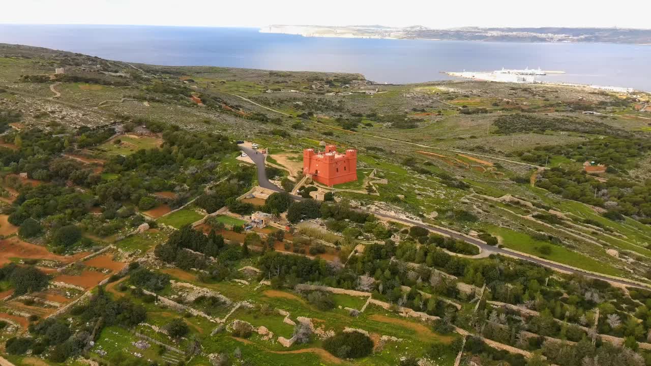 Drone shot ziplining towards Mellieha's Red Tower, also known as St Agatha's Tower
