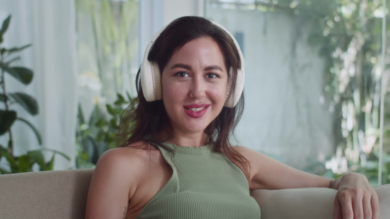 Portrait of Young Girl Listening to Music in Headphones