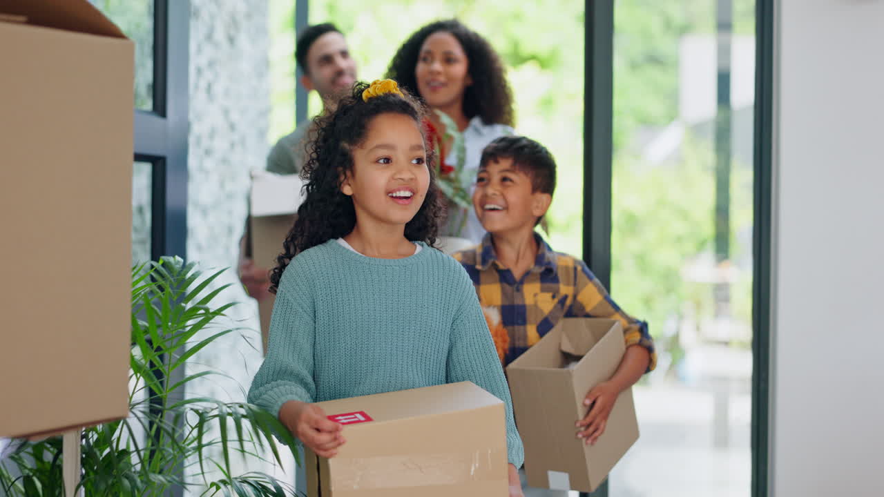 Family, front door and boxes for new home