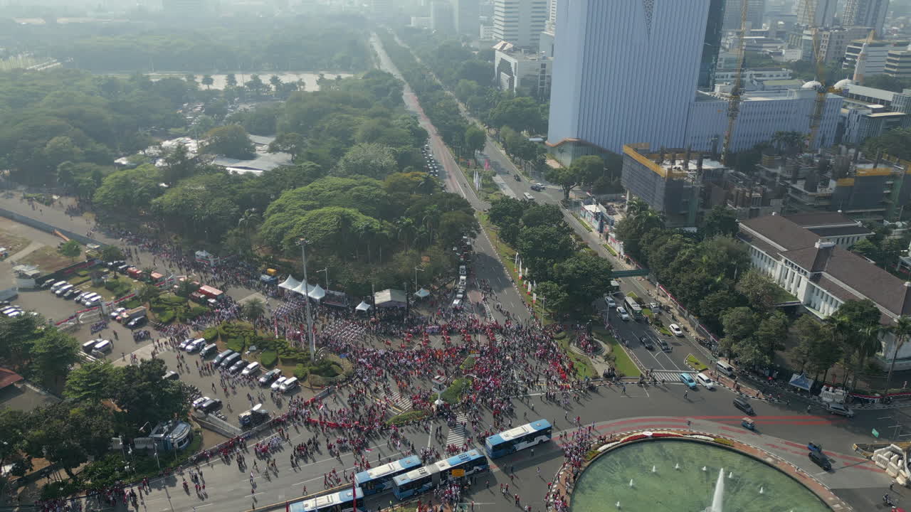 Traffic Navigates Indonesian Independence Parade Near Thamrin Fountain Jakarta Monas 4K 60FPS
