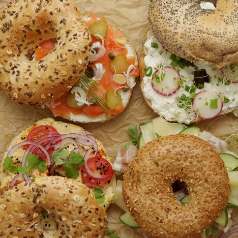 tasty colorful various bagels with healthy ingredients served on brown baking paper