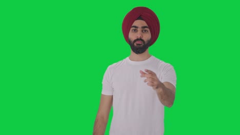 upset sikh indian man seeing shocking news green screen