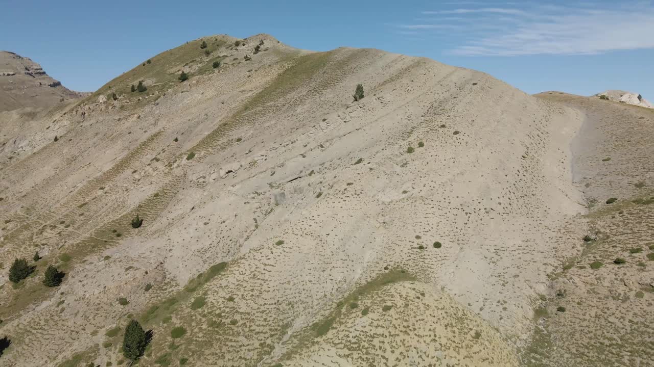 Aerial view of the top of the mountain range with some trees in La Cerdanya, Catalunya 4k