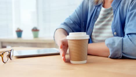 businesswoman using digital tablet at her desk