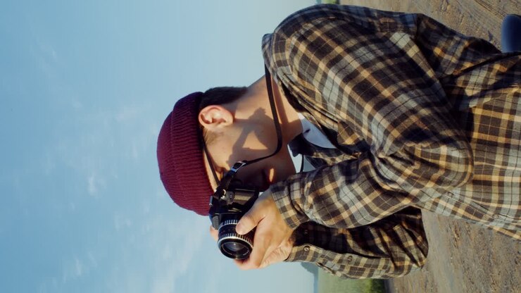 Photographer taking a photo in a field