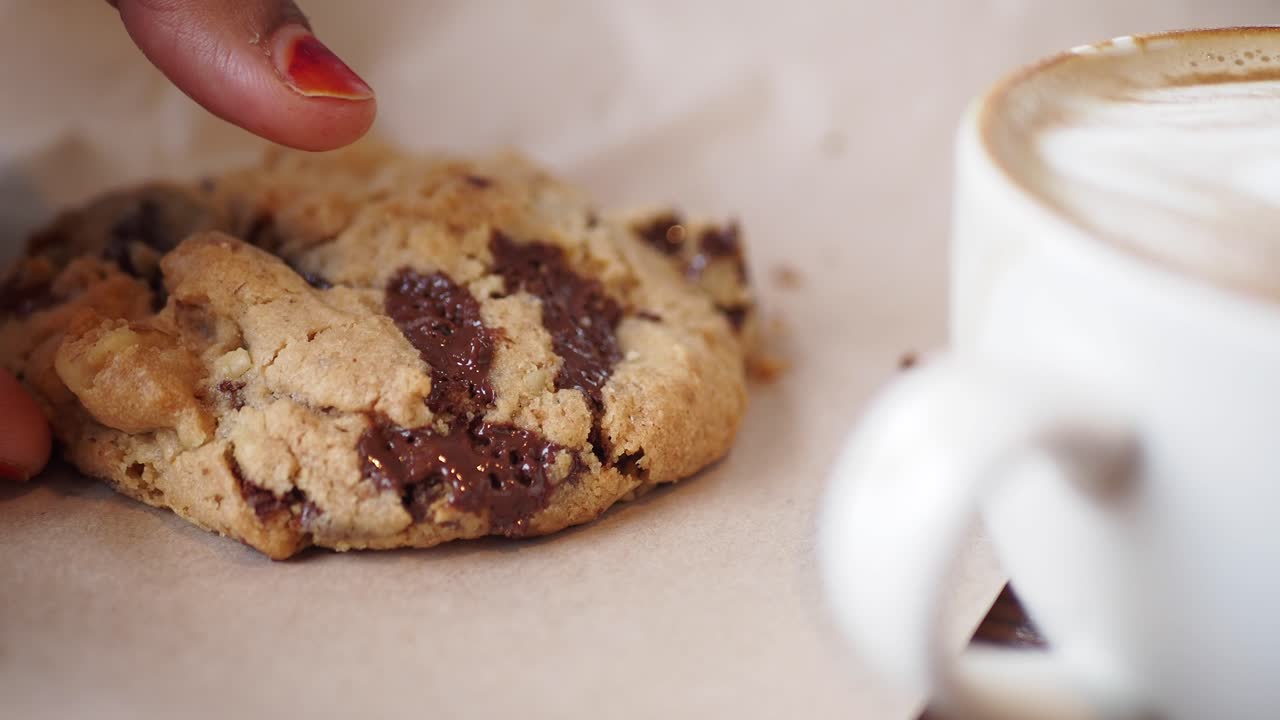 Woman Eating Chocolate Chip Cookies with Latte