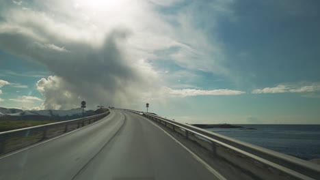a drive on the famous atlantic road in norway. view from the car. camera following all the curves and arches of the road, as it is leading through the archipelago
