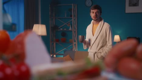 man drinking coffee at home in the morning
