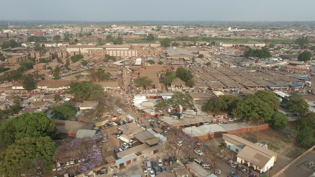 Aerial footage of a crowded and busy, Mbare Musika, and Matapi flats, in Harare Zimbabwe