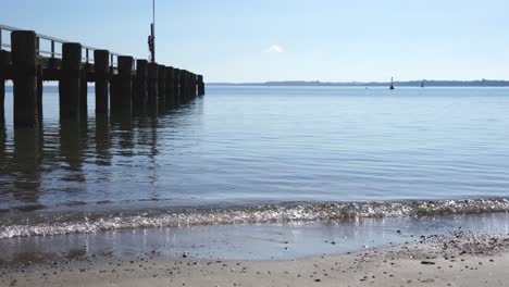 calm water splashes on the beach in beautiful weather