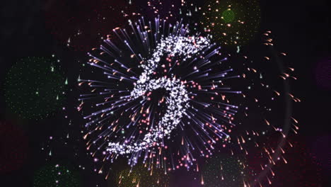 animación de cuenta atrás hasta la medianoche y fuegos artificiales sobre fondo negro