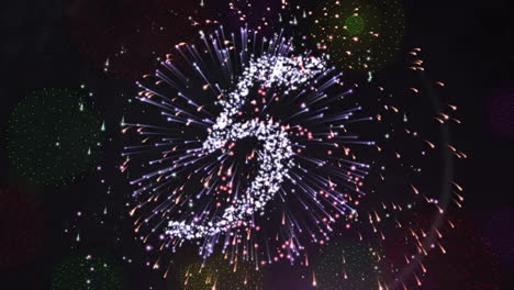 animation of countdown to midnight and fireworks on black background