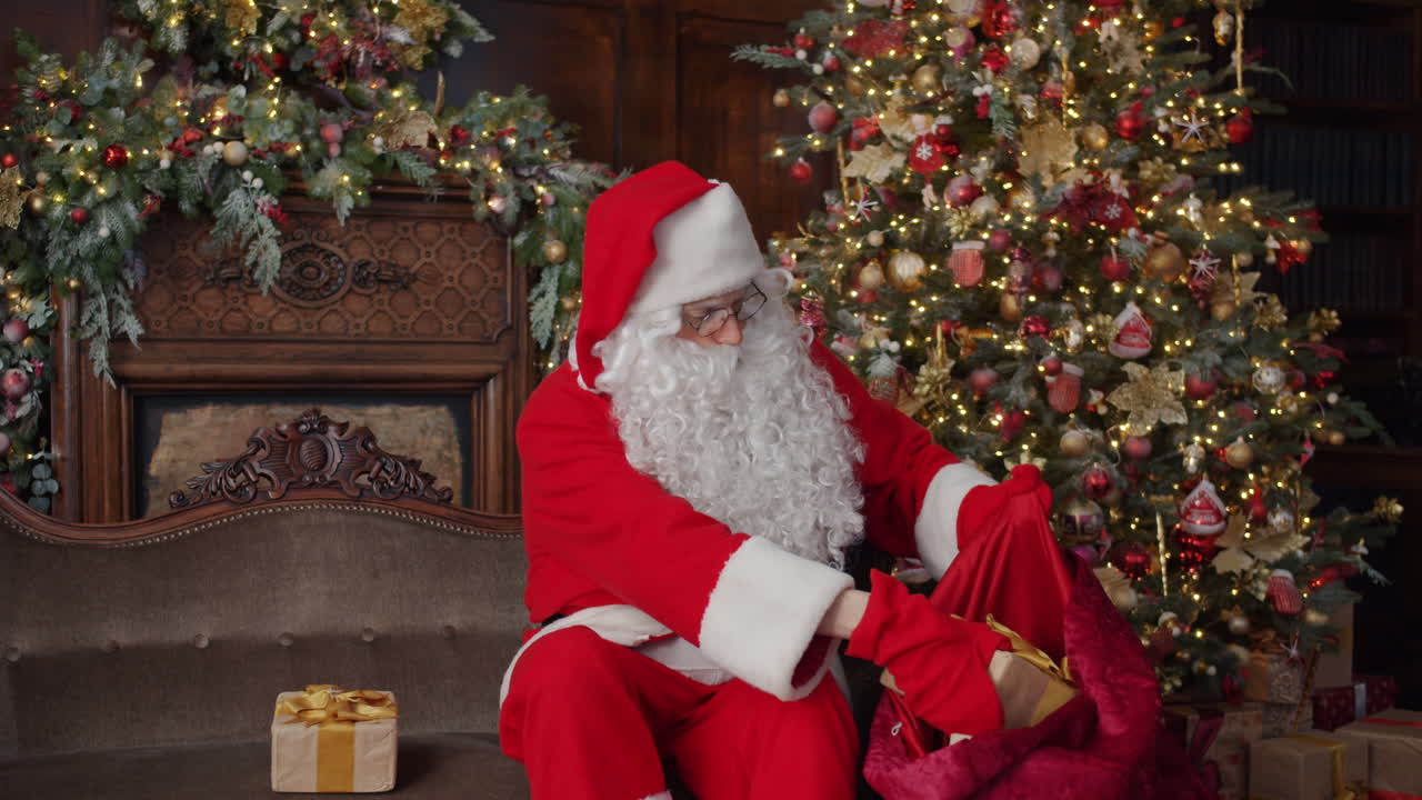 Santa Claus Opening Gifts by the Christmas Tree