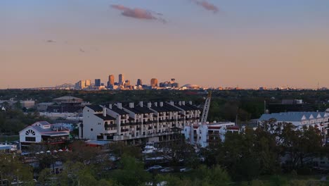 sunset over new orleans marina with the city skylight in the background