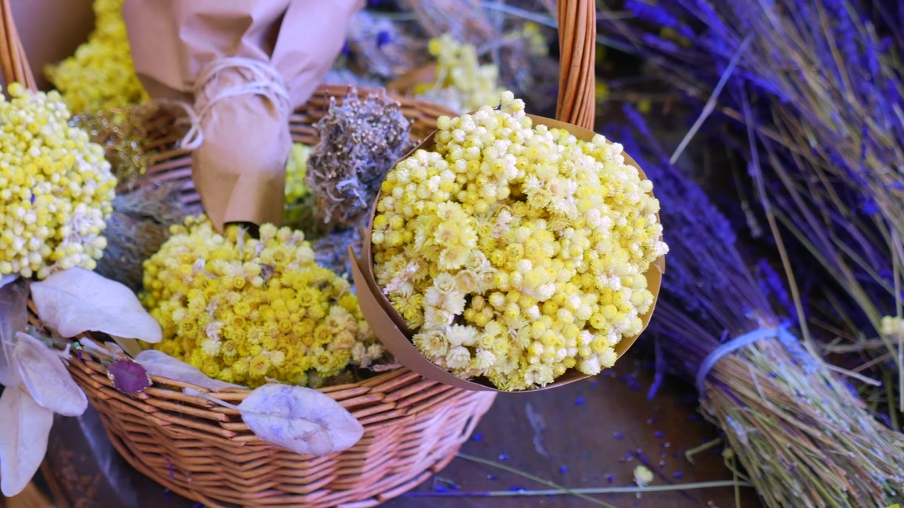 Wicker Basket Filled With Dried Yellow Flowers and Lavender
