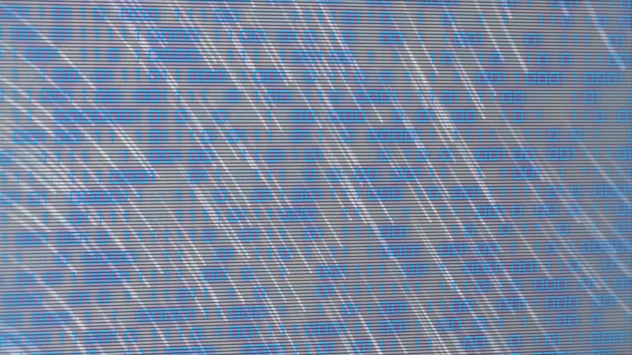 LED panel catching upper-left flare, blue glyphs blurring under diagonal streaks, simulating noise