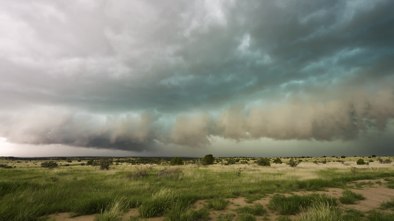 Dark Clouds Roll Across The Horizon Over Stunning Landscapes