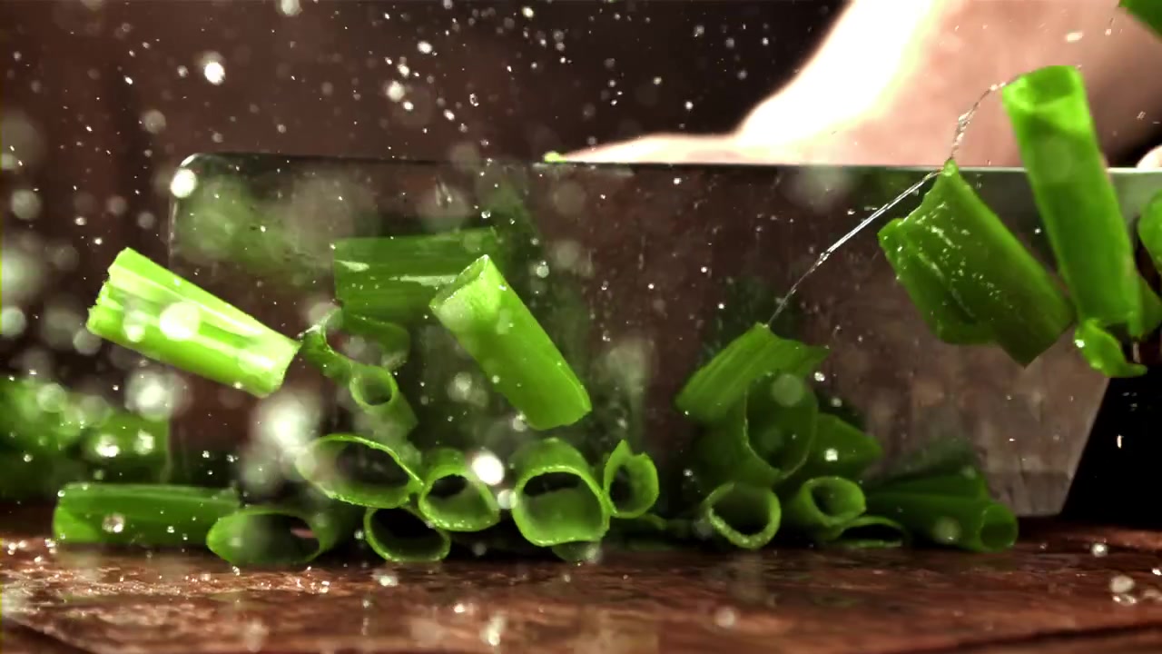 Chopping Fresh Green Onions in Slow Motion with a Knife