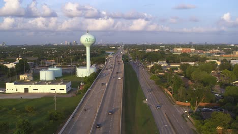 drone flyover of alief houston showing water tank and westpark tollway