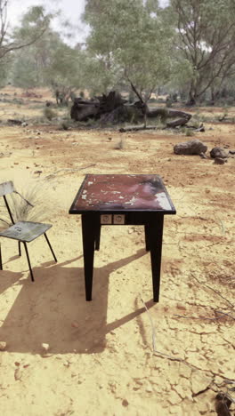 lonely table and chair in a vast australian landscape under bright sky
