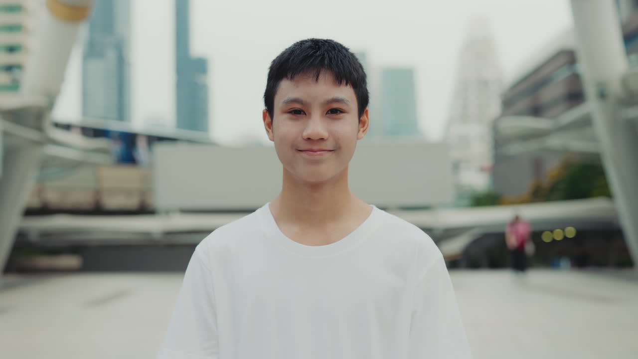 Portrait of an Asian man in an urban setting