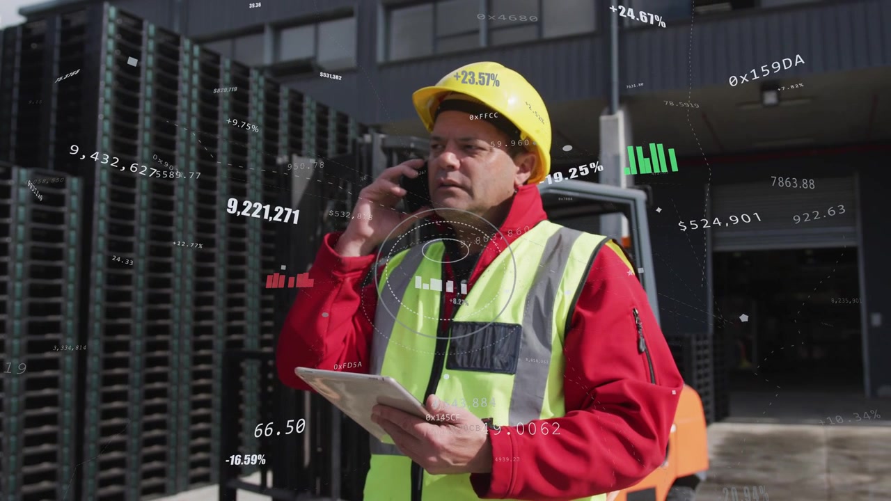 Warehouse lead taking call and checking tablet, viewing overlays, guiding forklift and crates