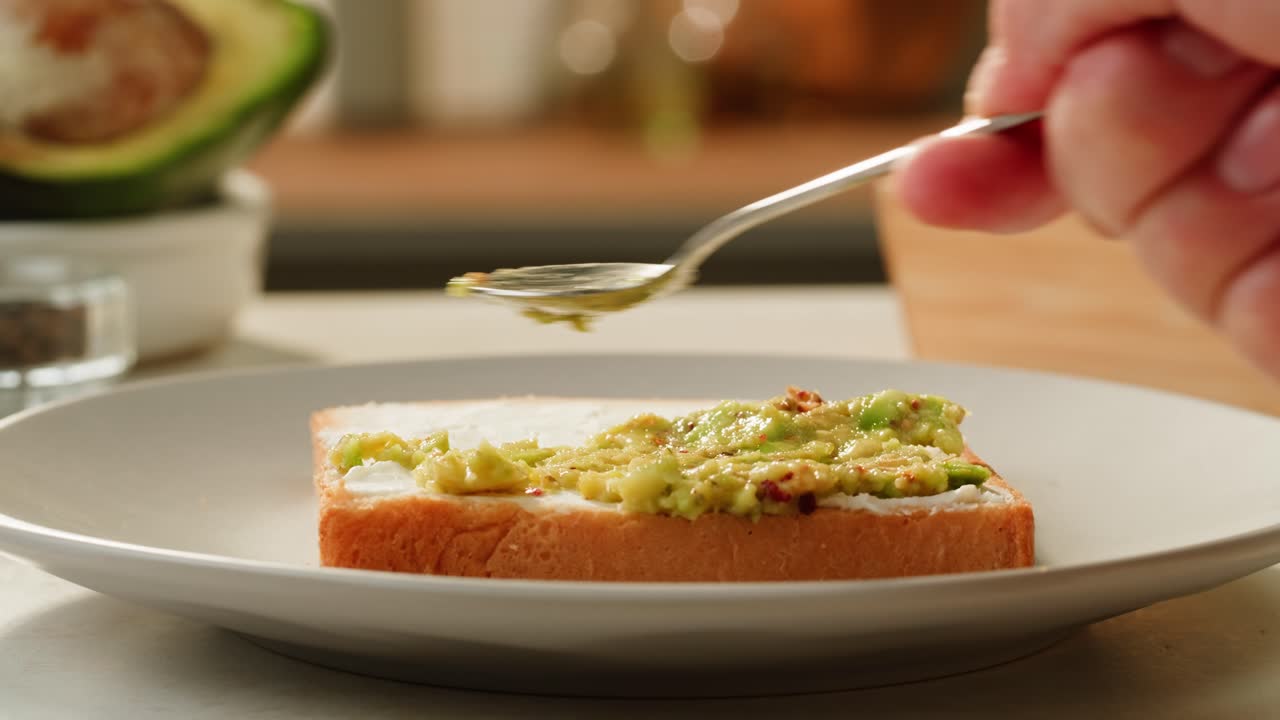 Preparing Avocado Toast with Cream Cheese
