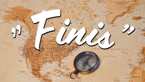 finis sign and a world map with compass