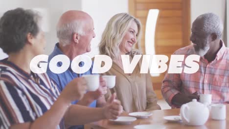 buenas vibraciones de texto contra dos parejas de alto nivel diversas sonriendo mientras toman café juntos en casa