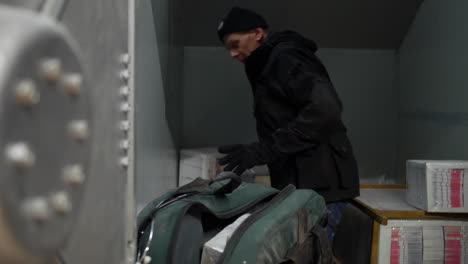 a bank robber clearing out a safe