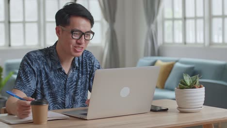 Asian Man Video Call On Laptop At Home, Video In 4K