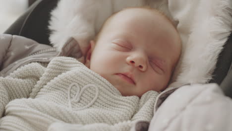 sleeping baby in a stroller
