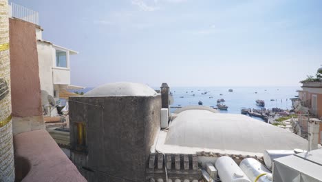 Amalfi-Positano-Italy-Immersive-Travel-Tourism-Mediterranean-Sea-Coast-Water-Europe,-Walking,-4K-|-Moving-To-Edge-of-Building-and-Viewing-Scenic-Mountainside-Homes-on-Iconic-Cliff,-Shaky