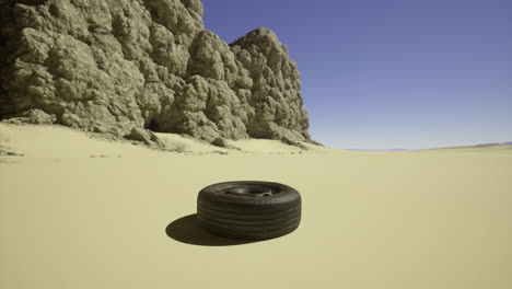 abandoned tire in a secluded desert landscape under clear blue sky