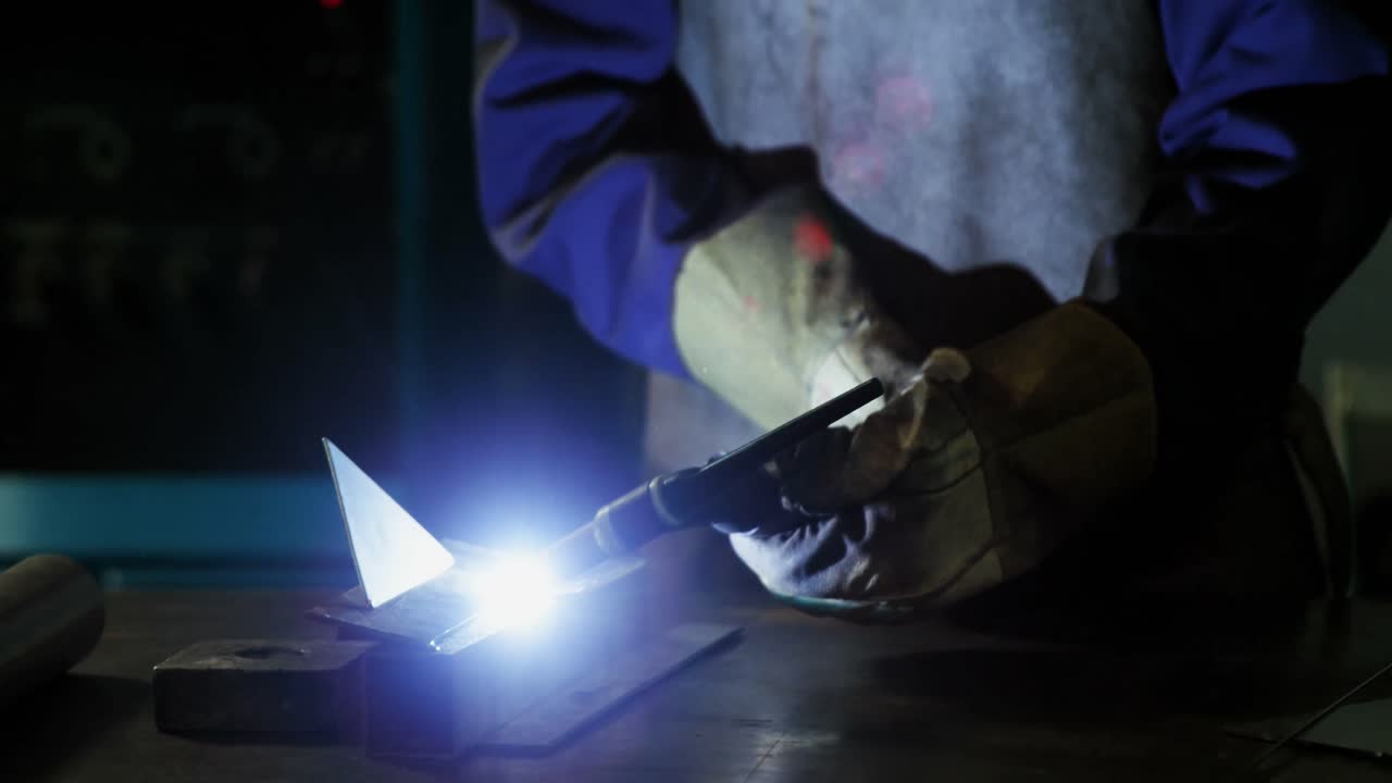 Welder welding a metal