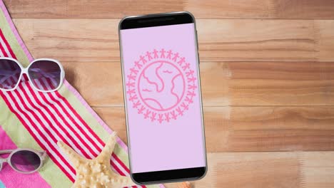 Animation-of-pink-globe-logo-on-smartphone-screen