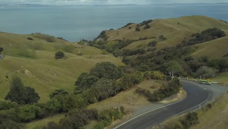 hills and roads near the coast in new zealand north island