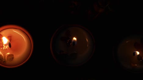 some blows off the diyas or lamps lit up for diwali 'festival of light', the most important ancient hindu festival celebrated signifying victory of light over darkness with strong wind breeze