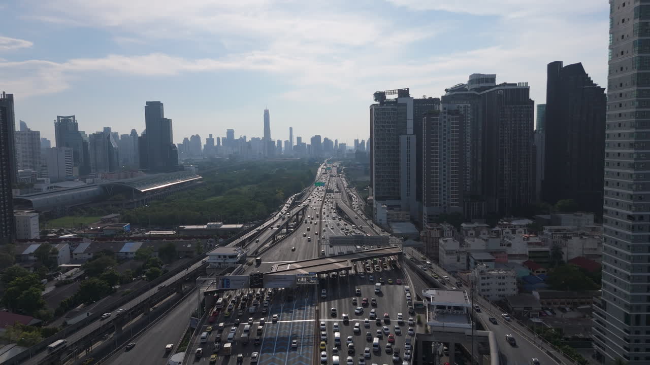 City Landscape And Road Traffic During Rush Hour On The Si Rat Expressway In Bangkok, Thailand. Aerial Drone Shot